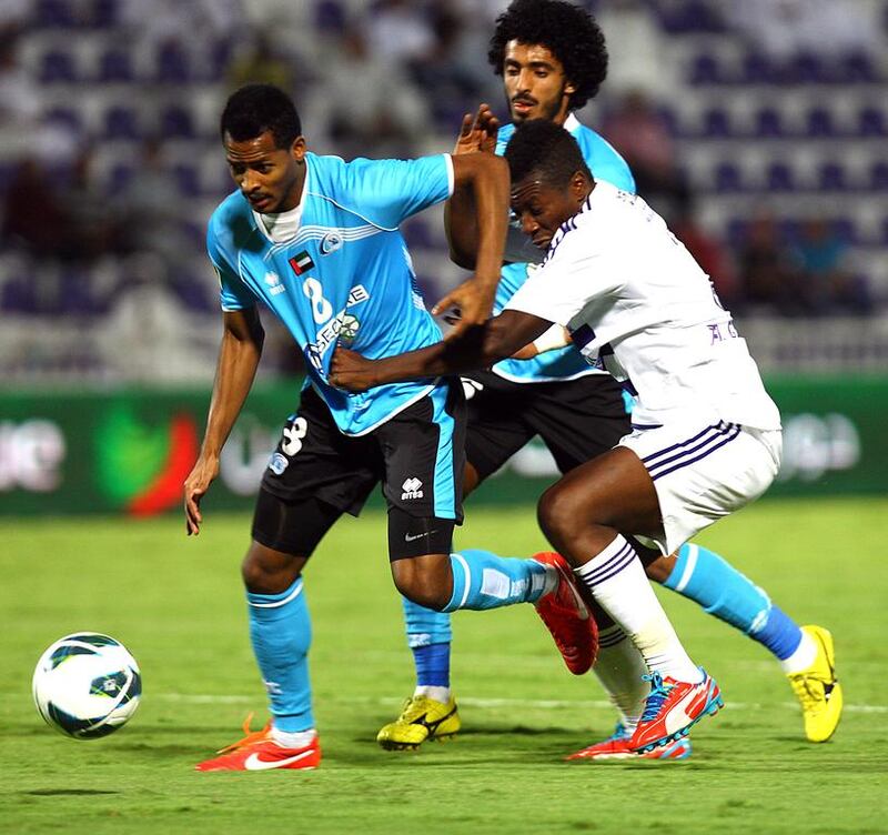 While with Baniyas last season, Mohammed Fawzi, left, battled many times with  Asamoah Gyan. This season that will only happen in training, as Fawzi has joined Gyan at Al Ain on a three-year deal. Satish Kumar / The National 