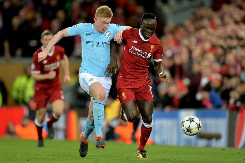 epa06645928 Manchester City's Kevin De Bruyne (L) in action against Liverpool's Sadio Mane (R) during the UEFA Champions League quarter final first leg match between FC Liverpool and Manchester City at Anfield Road, Liverpool, Britain, 04 April 2018.  EPA/PETER POWELL
