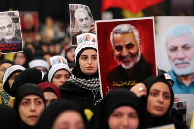 Hezbollah supporters hold pictures of Qassem Soleimani, an Iranian commander, center, and Abu Mahdi al-Muhandis, an Iraqi paramilitary chief, as Hassan Nasrallah, leader of Hezbollah, delivers a televised speech, in Beirut, Lebanon, on Sunday, Jan. 5, 2020. Nasrallah, the leader of Iran’s Lebanese ally, Hezbollah, said the the conflict had entered a “new phase” and the price of Soleimani’s death should be the end of U.S. military presence across the region. Photographer: Hasan Shaaban/Bloomberg