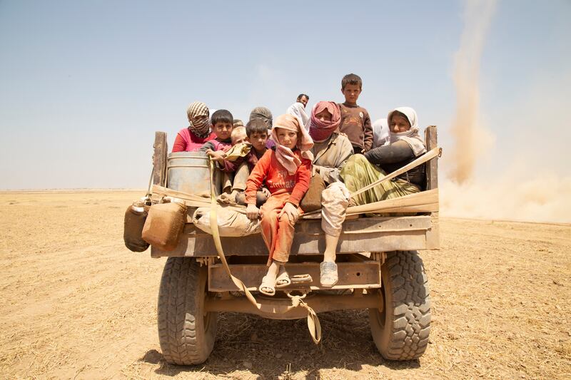 Children fleeing up Mount Sinjar, photo by Zmnanko Ismail.