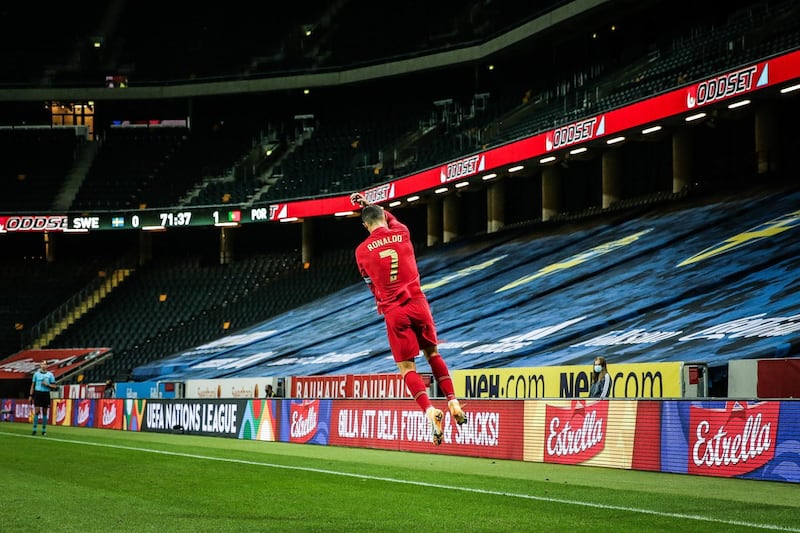 Cristiano Ronaldo celebrates after scoring a goal against Sweden, his 100th for the Portuguese national team. EPA