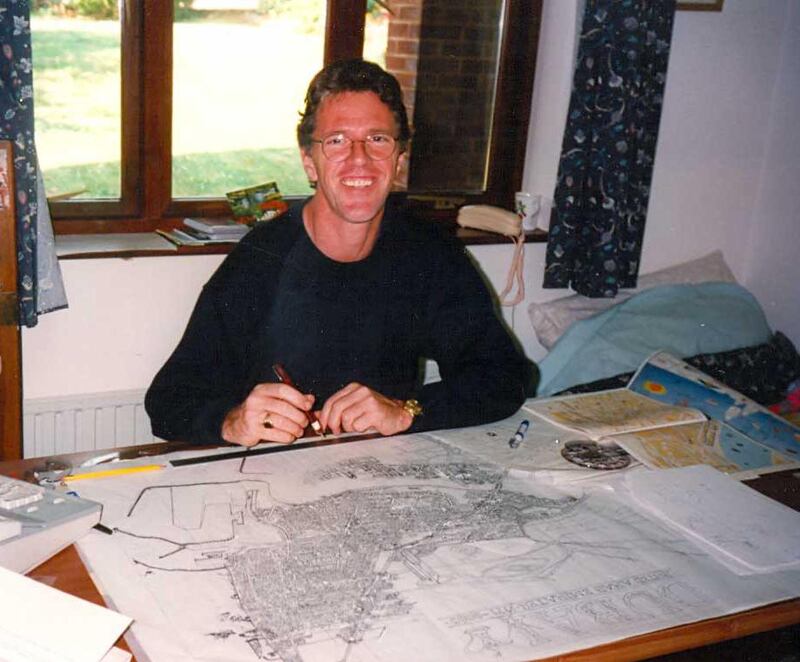 Russ North, the creator of the popular Life in Sunny Dubai poster, at work in his studio circa 2000. Courtesy:  Russ North / Cityview Maps