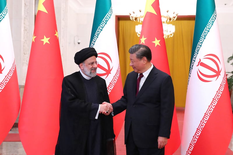 Chinese President Xi Jinping welcomes Iran's President Ebrahim Raisi to Beijing on Tuesday. AFP