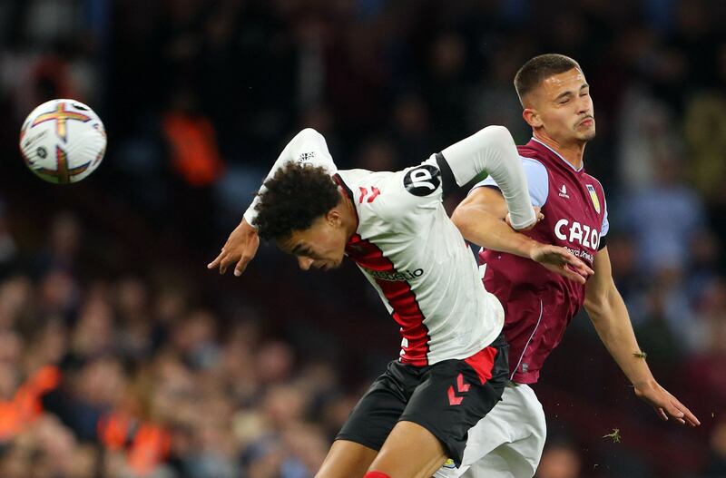 Southampton's defender Mohammed Salisu, left, and Aston Villa's midfielder Jaden Philogene-Bidace vie for the ball. AFP