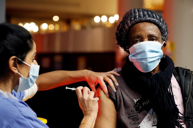 A health worker administers the Covid-19 vaccine inside a former nightclub that has been turned into a NHS vaccine centre in Batchwood Hall, St Albans, Britain, January 15, 2021. File photo / Reuters