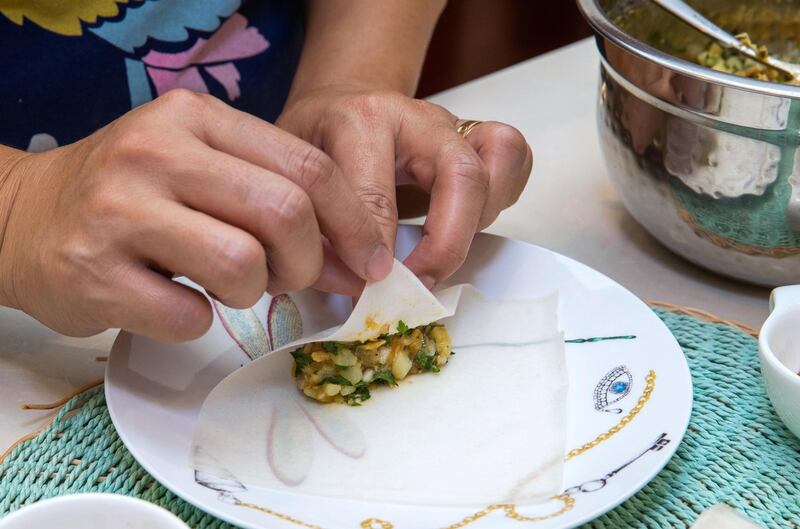 Abu Dhabi, United Arab Emirates, April 14, 2021.  Ramadan Recipes by Nejat Hadriche.  Tunisian  brik  in Arabic it is called fatma fingers.  It is made by shrimp and tuna.
Victor Besa/The National
Section:  lf
Reporter:  Hanan Sayed Worrell