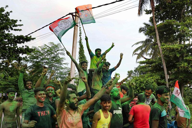Trinamool Congress supporters celebrate the party's victory in West Bengal's Panchayat elections on Tuesday.  AFP