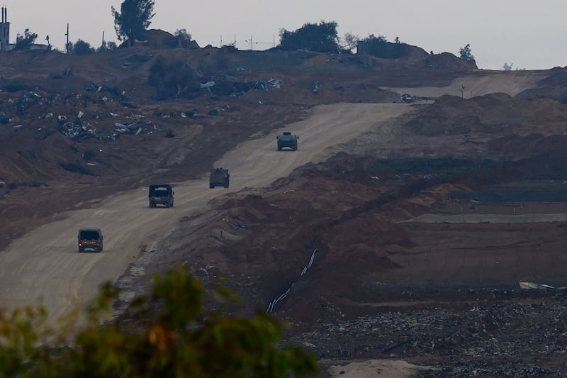 Israeli vehicles drive into Gaza from Israel. Getty Images