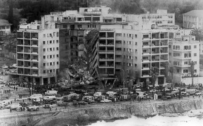 Aerial view of the United States embassy in Beirut, 18 April 1983, after a bomb destroyed part of the building. The whole front center section of the building collapsed from the blast. (Photo by US NAVY / AFP)