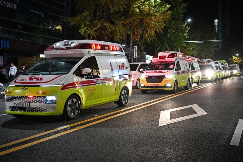 Ambulances line the road in the district of Itaewon shortly after the crowd surge. AFP
