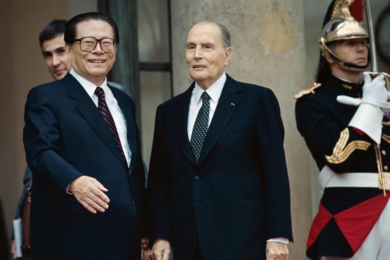 Jiang Zemin meets France's President Francois Mitterrand in Paris, September 9, 1994. AFP