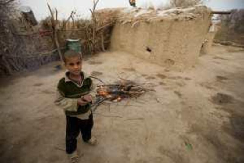 A young resident of Aziziyah island  60 km south east of Baghdad in the middle of the Tigris River, 7th February 2009. There are suggestions the island should be converted from small farms into a modern tourist resort, something all the islanders reject despite their poverty - few of the children go to school - and the promise of quick riches.