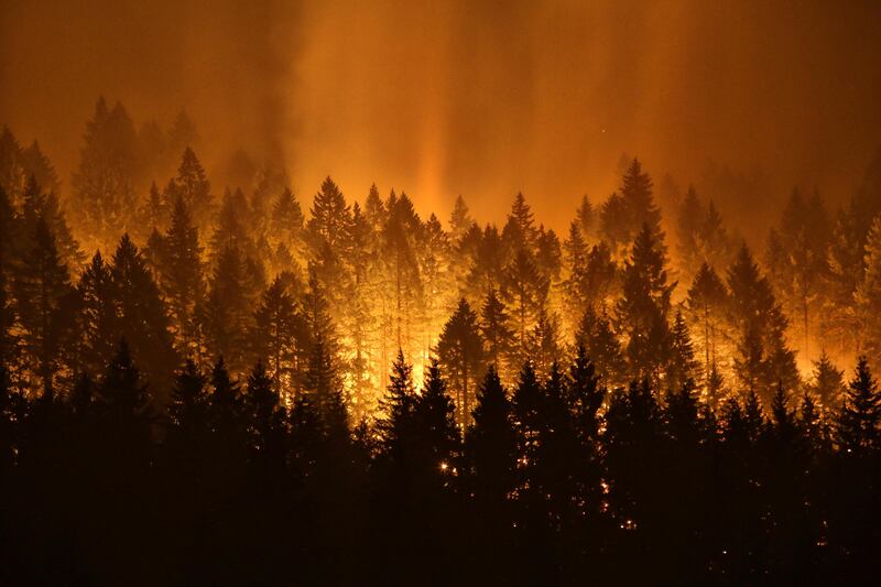 A wildfire burns near Cascade Locks and the Bridge of the Gods in Oregon in the United States. Genna Martin/ seattlepi.com via AP