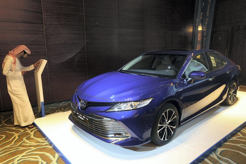 Dubai, June, 03, 2018:  Visitor take a look at the new Toyota Camry HEV ( HYBRID ) which was unveiled for the first time in the UAE in Dubai. Satish Kumar for the National / Story by Adam Workman