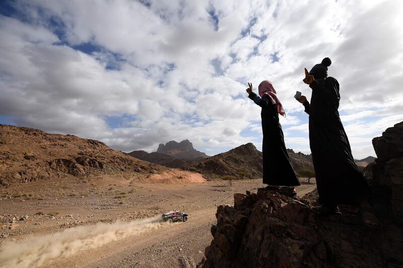 Spectators watch SRT Racing's  Mathieu Serradori and Belgian co-driver Fabian Lurquin compete during Stage 4 of the Dakar Rally, between Neom and Al-Ula in Saudi Arabia, on Wednesday, January 8. AFP