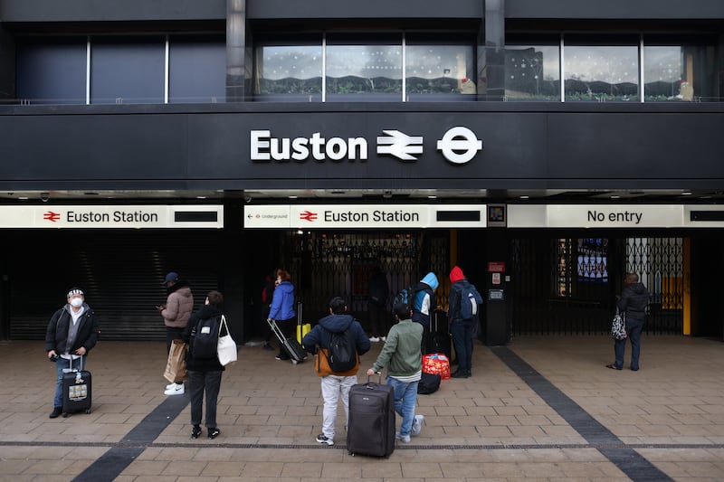 Travellers waiting for Euston station to open in London. Getty Images