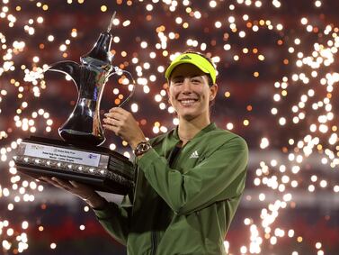 Garbine Muguruza celebrates with the trophy following victory in the Dubai Duty Free Tennis Championships final. Getty Images