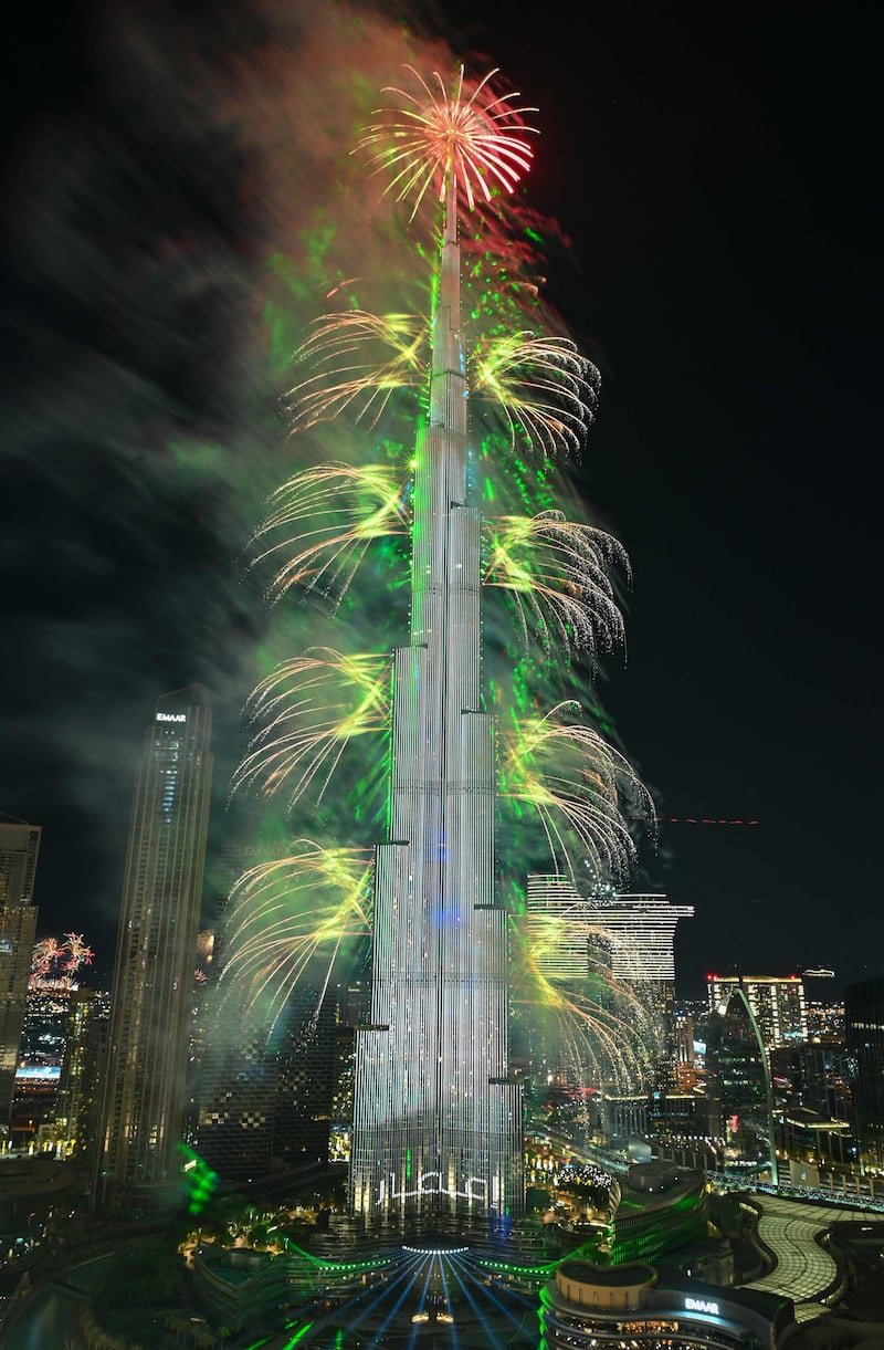 The world’s tallest tower shines brightly in a dazzling array of colours and lights at the stroke of midnight. AFP