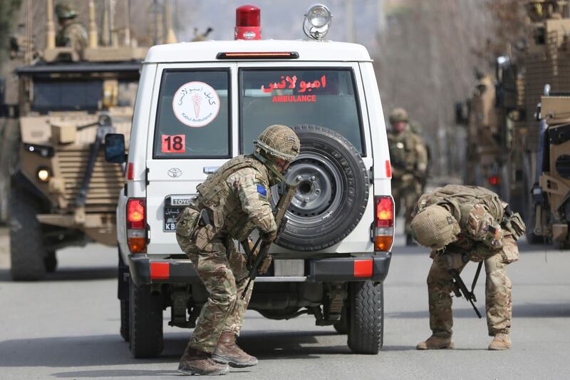 British soldiers with NATO-led Resolute Support Mission forces checks an ambulance at the site of an attack in Kabul, Afghanistan. AP Photo