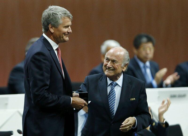 David Gill, left, receives his nomination at the Executive Committee from Fifa President Sepp Blatter, but the English FA chief has since rejected the position. Arnd Wiegmann / Reuters