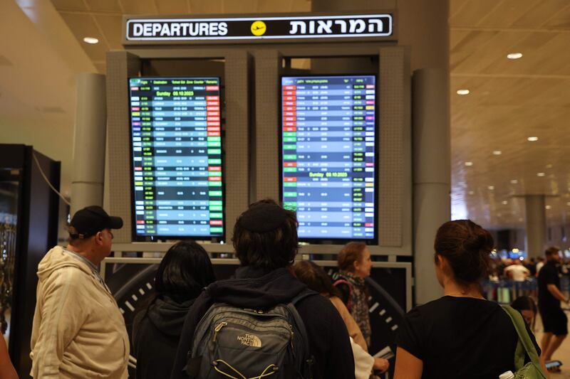 Passengers look at a departure board at Ben Gurion Airport near Tel Aviv. AFP