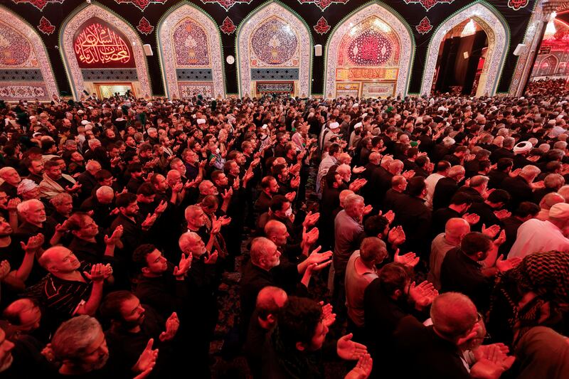 Shi'ite Muslim pilgrims attend prayers during the holy Shi'ite ritual of Arbaeen at the shrine of Imam Hussein, in the holy city of Kerbala.
