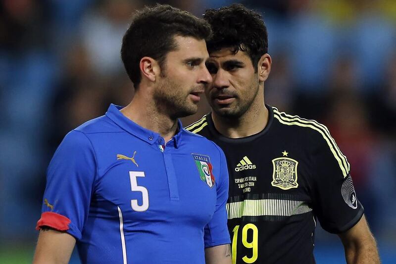 Thiago Motta and Italy lost to Spain 1-0. They'll play in Group D at the 2014 World Cup with Uruguay, Costa Rica and England. Andres Kudacki / AP