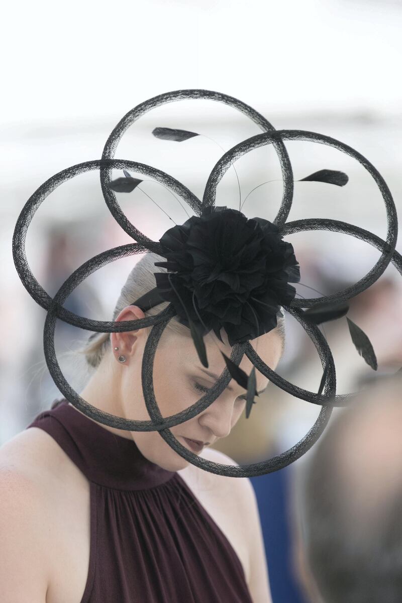 DUBAI, UNITED ARAB EMIRATES - MARCH 31, 2018. 

A racegoer at Dubai World Cup 2018.

(Photo by Reem Mohammed/The National)

Reporter: 
Section: NA