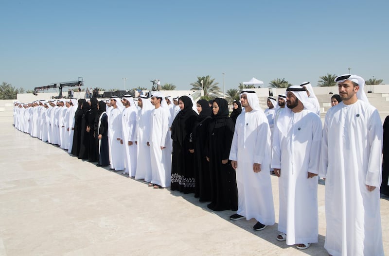 ABU DHABI, UNITED ARAB EMIRATES - November 30, 2017: UAE citizens observe a moment of silence during a Commemoration Day flag raising ceremony at Wahat Al Karama, a memorial dedicated to the memory of UAE’s National Heroes in honour of their sacrifice and in recognition of their heroism.

( Saeed Al Neyadi / Crown Prince Court - Abu Dhabi )
---