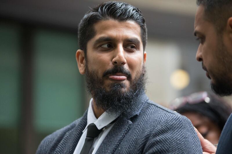International director of campaign group Cage, Muhammad Rabbani (C) arrives at Westminster Magistrates' Court in London on September 25, 2017, for his trial, after being accused of refusing to reveal his mobile phone password at Heathrow Airport last year. / AFP PHOTO / Daniel LEAL-OLIVAS