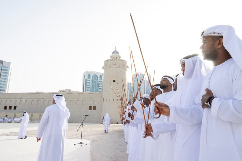 Traditional dancers perform during the group wedding at Qasr Al Hosn.
