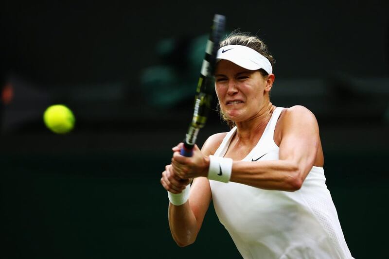 Eugenie Bouchard of Canada hits a forehand return during her singles match against Alize Cornet on Monday in the fourth round of the 2014 Wimbledon Championships. Bouchard won in straight sets. Clive Brunskill / Getty Images