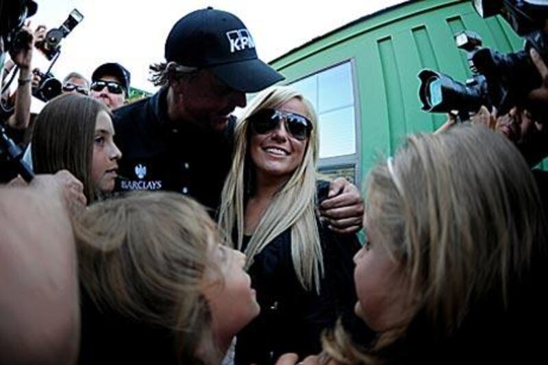 Phil Mickelson hugged his wife, Amy, in an embrace that lasted more than half a minute. The couple have shared such congratulatory moments before, but not under these circumstances.