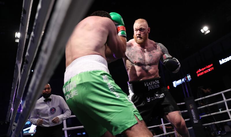 Hafthor Bjornsson (R) of Iceland in action against Devon Larratt of Canada during their Titan weight boxing match during the Core Sports Fight Night in the Gulf Emirate of Dubai, United Arab Emirates, 18 September 2021.   EPA / ALI HAIDER