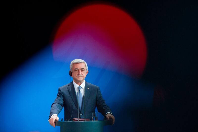 (FILES) In this file photo taken on April 6, 2016 Armenian President Serzh Sarkisian gives a joint press conference with German chancellor Angela Merkel (unseen), after meeting at the Chancellery in Berlin.
Armenia's former president Serzh Sarkisian, who was last week elected prime minister triggering major protests, resigned on April 23, 2018, his office said. "I've made a mistake... I am leaving the post of the country's leader," Sarkisian was quoted as saying in a statement by his press service, Armenia's state news agency Armenpress reported. / AFP PHOTO / STEFFI LOOS