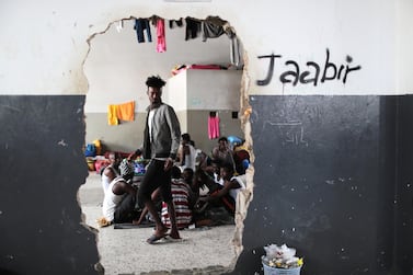 Migrants at Tajora shelter centre feel unsafe to leave. Reuters