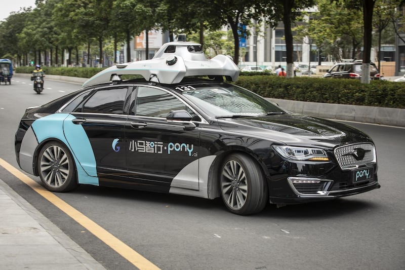 A Pony.ai Inc. autonomous vehicle travels along a road during a demonstration in the Nansha district of Guangzhou, Guangdong Province, China, on Wednesday, April 10, 2019. Domestic and foreign testers are putting cars, buses, trucks and delivery vans through self-driving trials to teach them how to navigate the notoriously congested streets of the world's biggest auto market. Photographer: Qilai Shen/Bloomberg