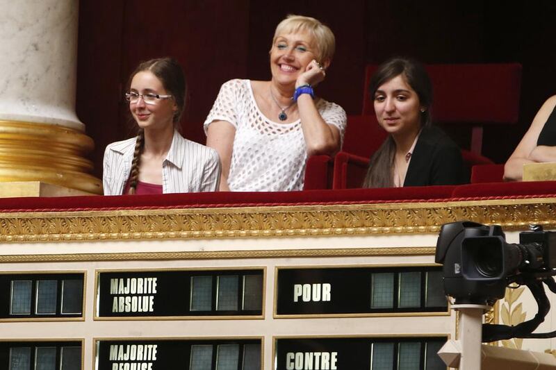 Myriam Bourhail, right, who obtained the best baccalaureat high school exam result with the average mark of 21.03 over 20, and Jane Marchand, left, who obtained the third best average mark, at the question-and-answer session at the National Assembly in Paris on July 15, 2014. Myriam Bourhail and Jane Marchand were students at the European secondary school of Villers-Cotterets in Aisne region. Charles Platiau/Reuters