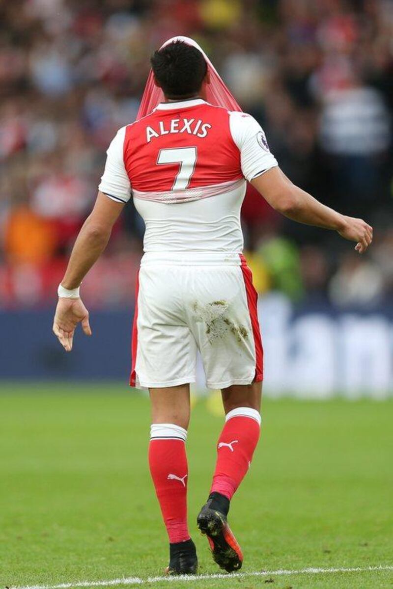 Alexis Sanchez of Arsenal reacts during the Premier League match against Hull City. Alex Morton / Getty Images