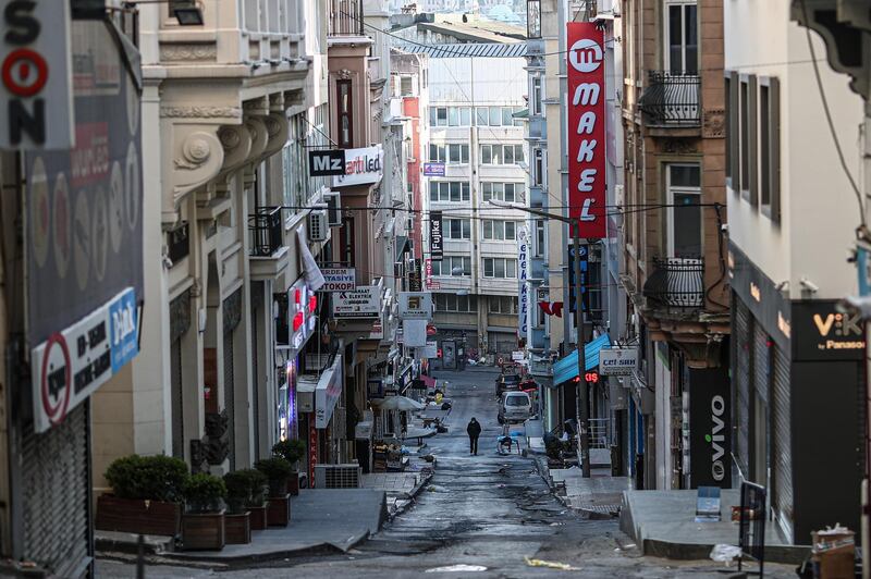 A man walks on an empty street in Istanbul.  EPA