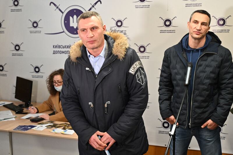 Kyiv mayor Vitali Klitschko, left, and his brother and fellow former heavyweight boxing champion Wladimir, during a visit to a volunteers' recruitment centre in Kyiv on February 2. AFP