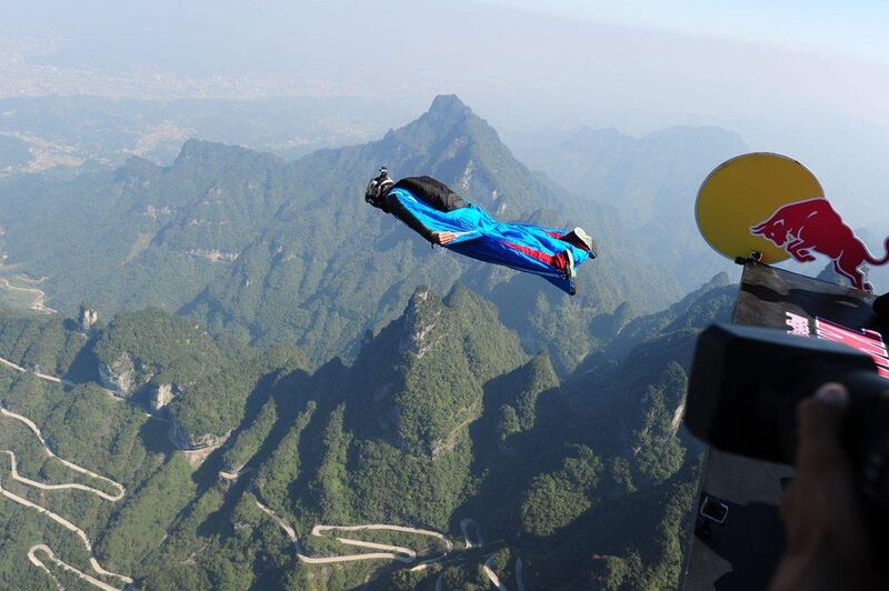 A competitor begins his jump from Tianmen Mountain on Friday during the Red Bull wingsuit flying China Grand Prix. ChinaFotoPress / Getty Images