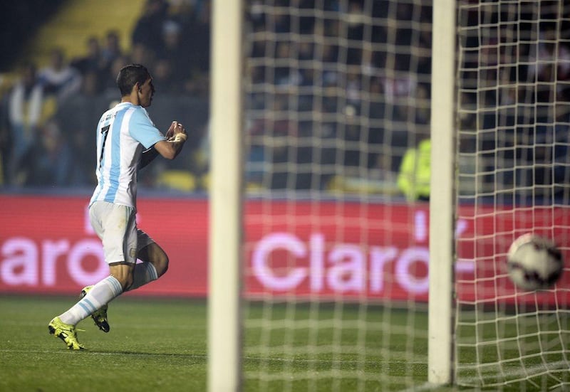 Argentina's Angel Di Maria celebrates after scoring his side's third goal to make it 3-1 against Paraguay on Tuesday night in the Copa America semi-final. Juan Mabromata / AFP