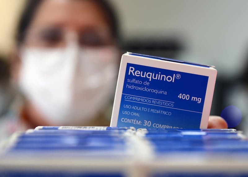 A health worker holds a box of hydroxychloroquine at the pharmacy of the Nossa Senhora da Conceicao hospital, amid the coronavirus disease (COVID-19) outbreak in Porto Alegre, Brazil, May 26, 2020. REUTERS/Diego Vara