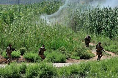 Iraqi forces during a search operation in Taramiyah, 50 kilometres north of Baghdad, April 30, 2020. AP