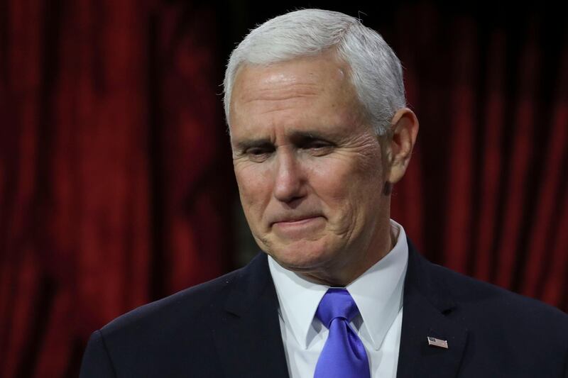 (FILES) In this file photo taken on January 3, 2019 US Vice President Mike Pence reacts during the swearing-in re-enactments for recently elected senators in the Old Senate Chamber on Capitol Hill in Washington, DC. Vice President Mike Pence said the United States would fight to ensure the defeat of the Islamic State movement but reiterated plans to pull troops out of Syria after an attack there killed US service members. "We'll stay in the region and we'll stay in the fight to ensure that ISIS does not rear its ugly head again," Pence told a gathering in Washington of US ambassadors stationed around the world, January 16, 2019.
 / AFP / Alex Edelman
