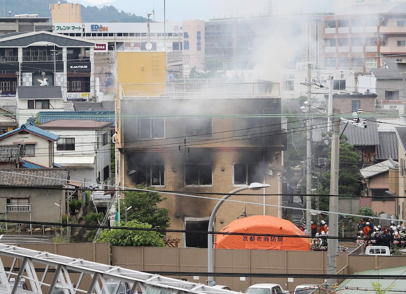 This picture shows a general view of smoke still coming from the building. AFP