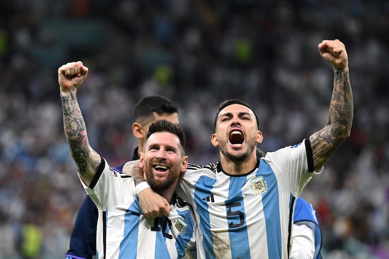 Lionel Messi and Leandro Paredes celebrate after Argentina defeated the Netherlands in the penalty shoot-out in their World Cup quarter-final at the Lusail Stadium, on December 9, 2022. Getty