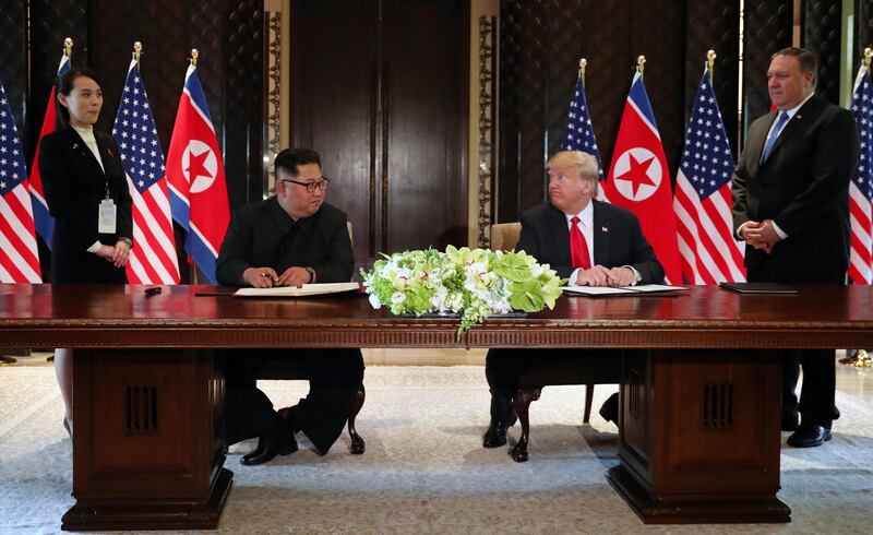 US president Donald Trump and North Korea leader Kim Jong-un look at each other before signing documents that acknowledge the progress of the talks and pledge to keep momentum going, after their summit. Jonathan Ernst / Reuters