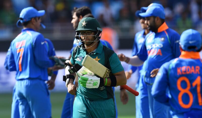 Pakistan batsman Imam-ul-Haq (C) leaves the field after being dismissed during the one day international (ODI) Asia Cup cricket match between Pakistan and India at the Dubai International Cricket Stadium in Dubai on September 19, 2018. / AFP / ISHARA S. KODIKARA
